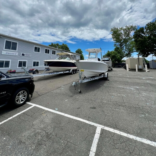 Boat in parking lot of Petzold's Marine Center in Norwalk, CT